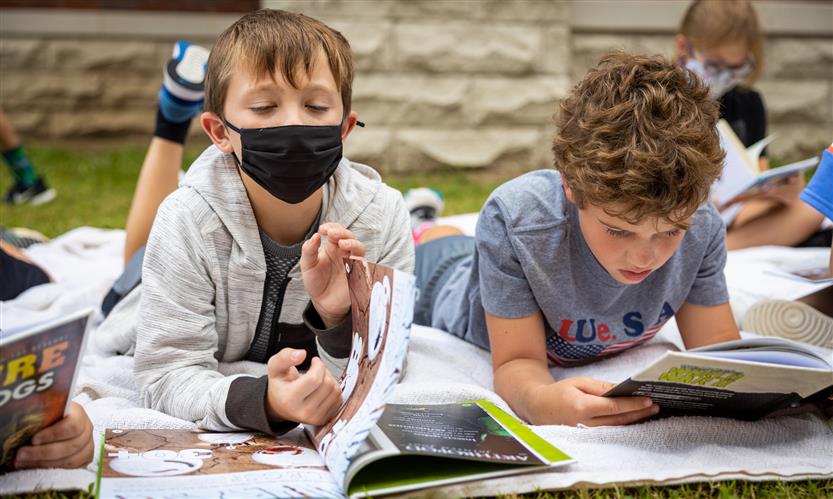 Students read books outside